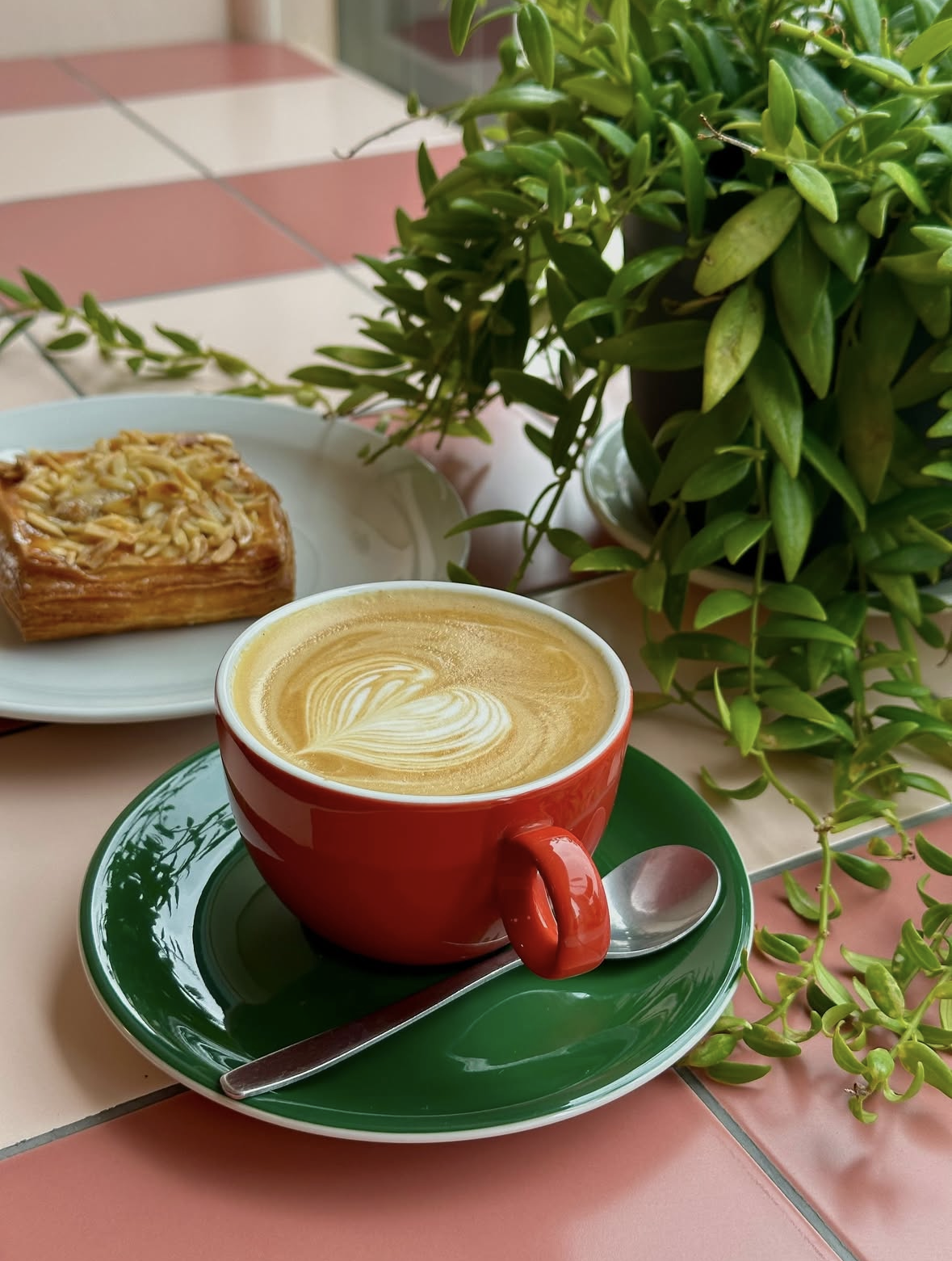 Speciality coffee and almond croissant