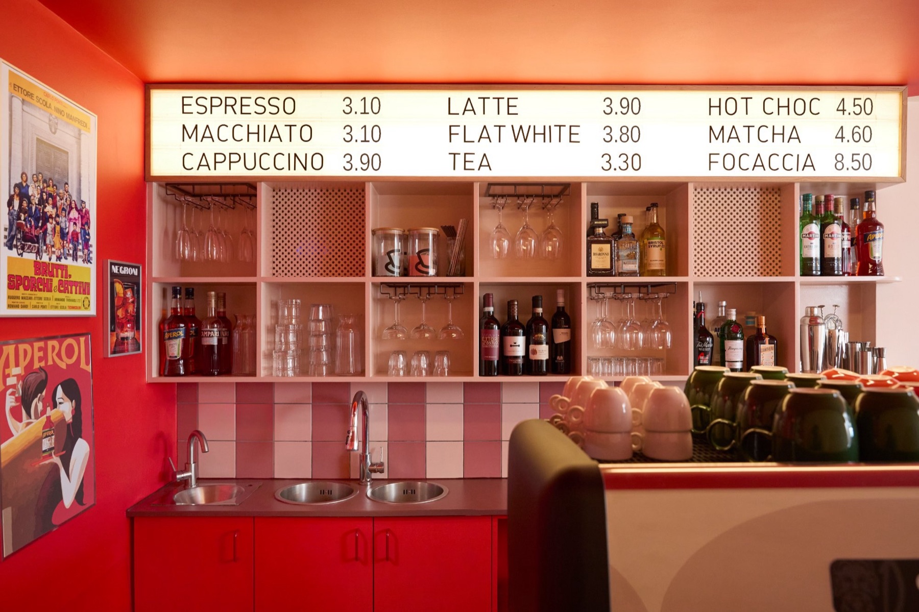 INTERVALLO bar with illuminated menu board and drinks shelf