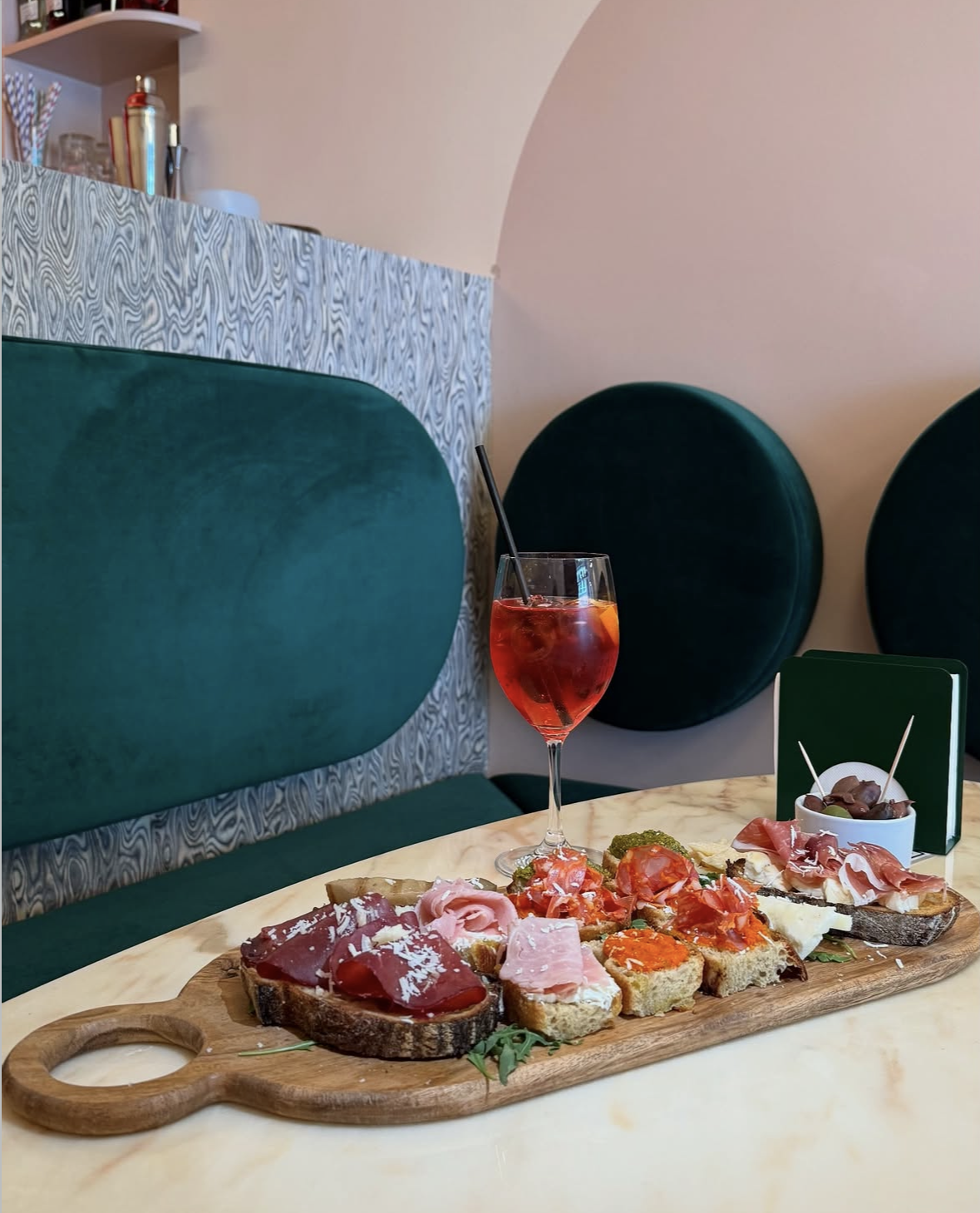 Italian aperitivo board with cheese, charcuterie and spritz at Intervallo bar Deptford London